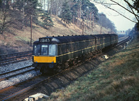 Class 117 DMU in green livery with yellow panel