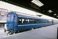 Class 127 DMU in blue with a white waist band
