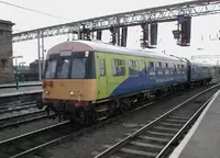 Two-car Class 101 DMU Iris II painted in lime greem and blue with yellow end