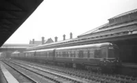 Several Derby Lightweight DMUs in Workington station on a rainy day