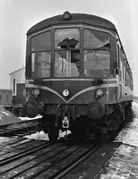 Accident damaged E79614 at Cambridge diesel depot. It had struck a lorry on an occupation crossing between Worlington and Isleham on the Mildenhall branch while working the 7.34am ex Mildenhall on 15 January 1960. The photo is undated but will have been taken soon afterwards. The location of the accident is sometimes given as "Freckenham crossing" which I translate as being Smith's occupation crossing No. 61 just west of Worlington Golf Links Halt. The lorry, which was destroyed, had three occupants of which two died at the scene and the third subsequently. This may suggest the DMU struck the front, i.e. cab, end of the lorry. The Mildenhall branch had a blanket speed limit of 30mph so the DMU would not have been travelling any faster.
